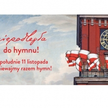 Po prawej część budynku z zegarem, na tarasie wywieszone wiele flag biało czerwonych. Po lewej czerwony napis: niepodelgła do hymnu, w południe 11 listopada zaśpiewajmy razem hymn.